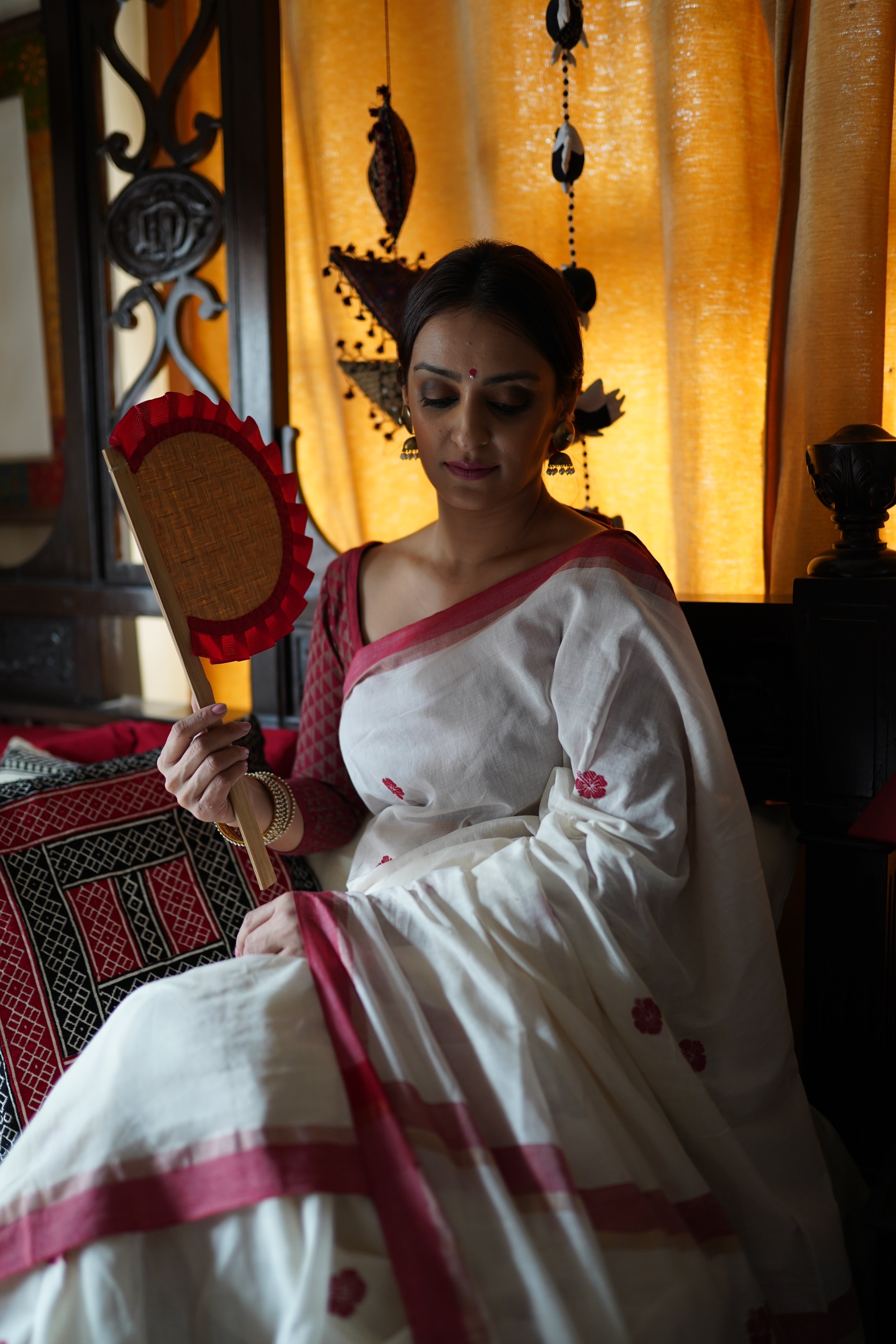 Handwoven white cotton saree with red border