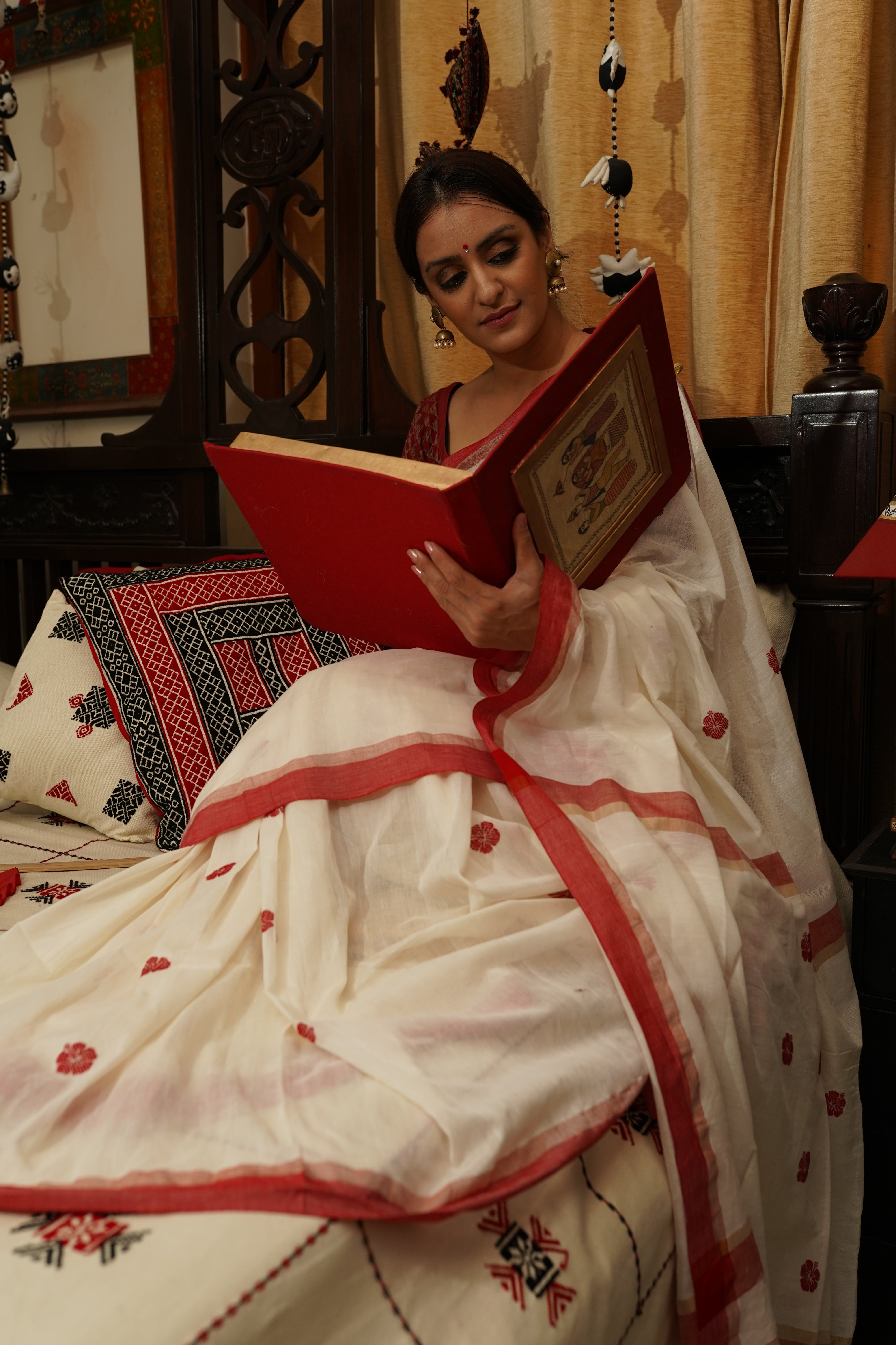 Handwoven white cotton saree with red border