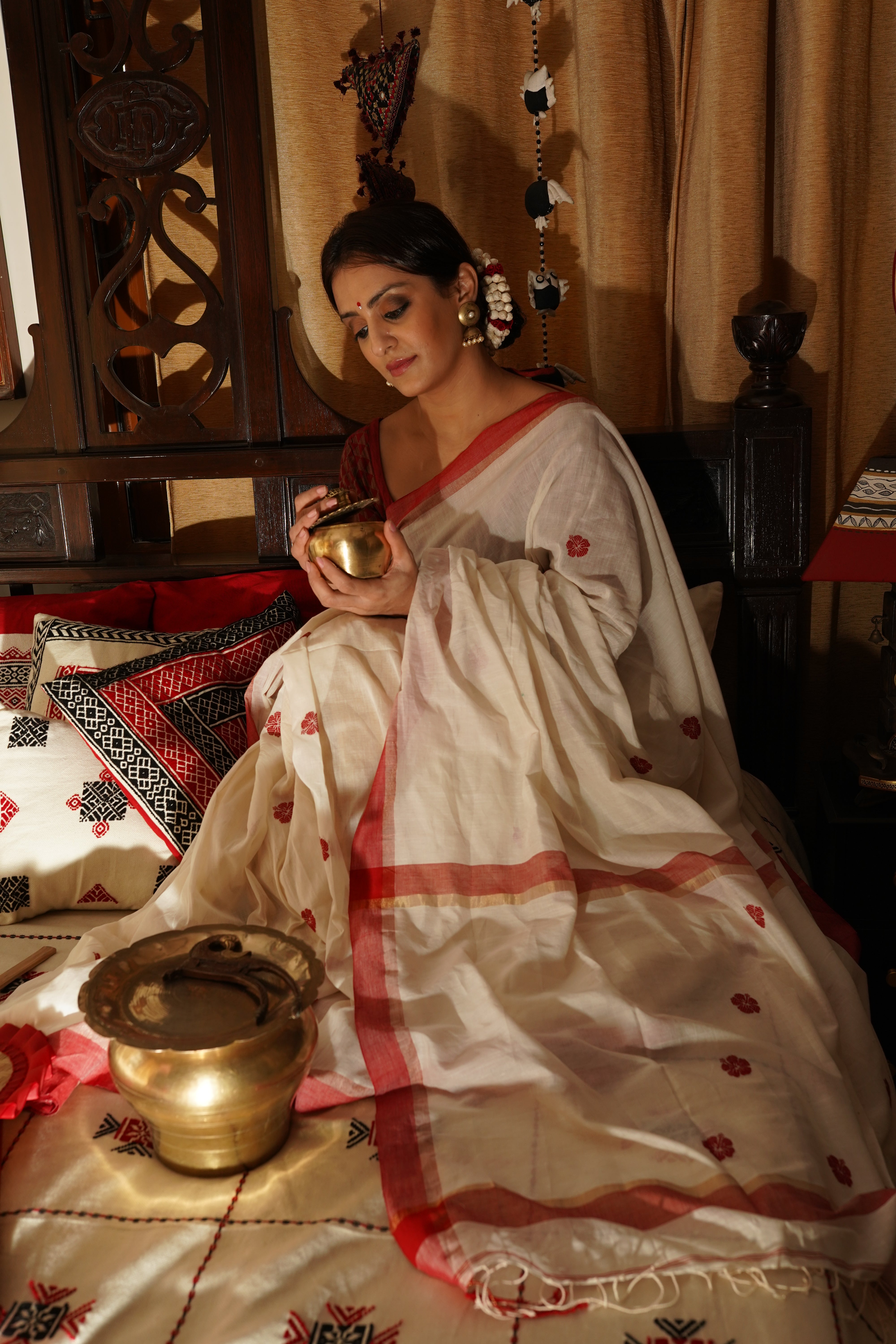 Handwoven white cotton saree with red border