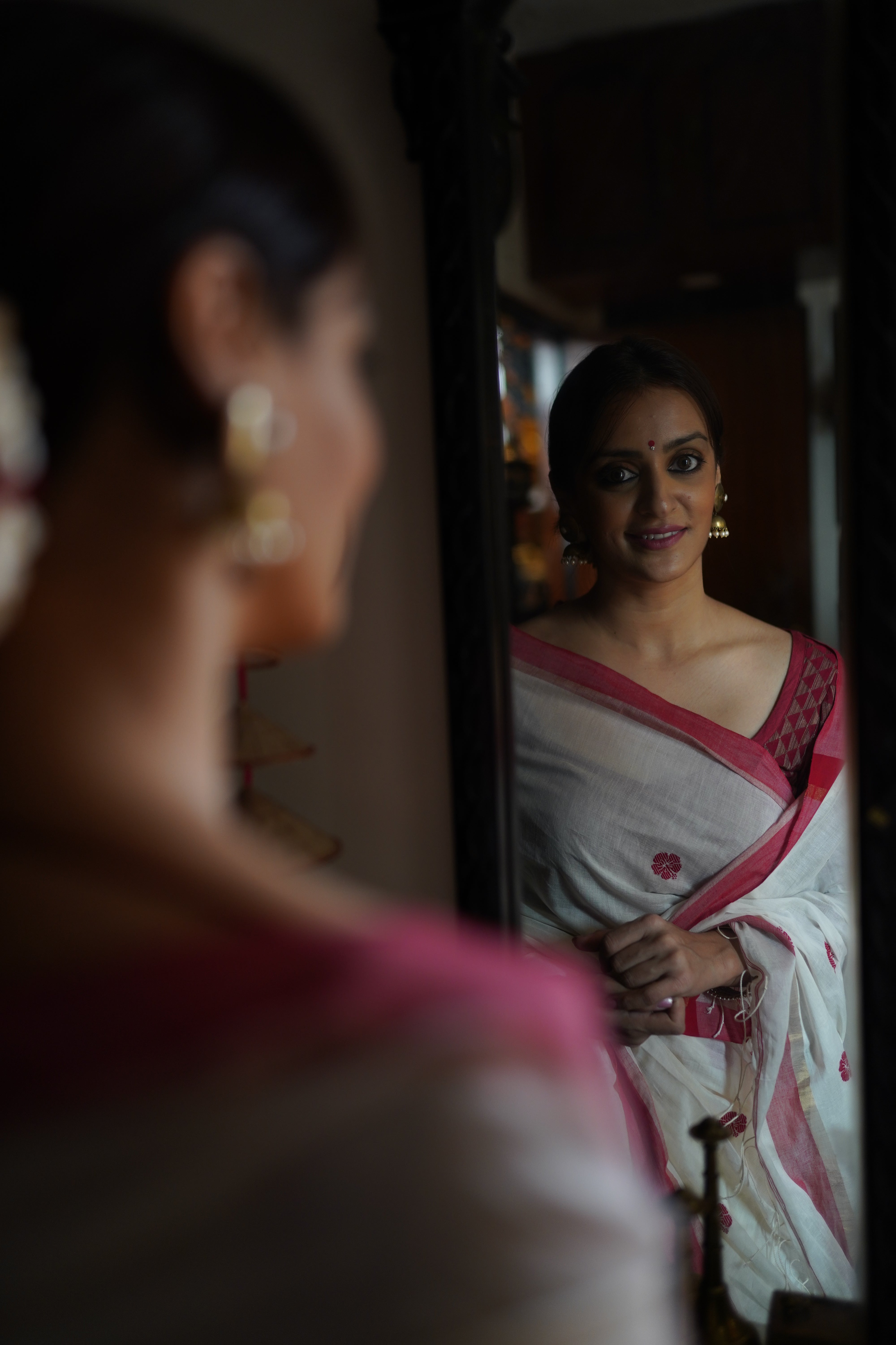 Handwoven white cotton saree with red border