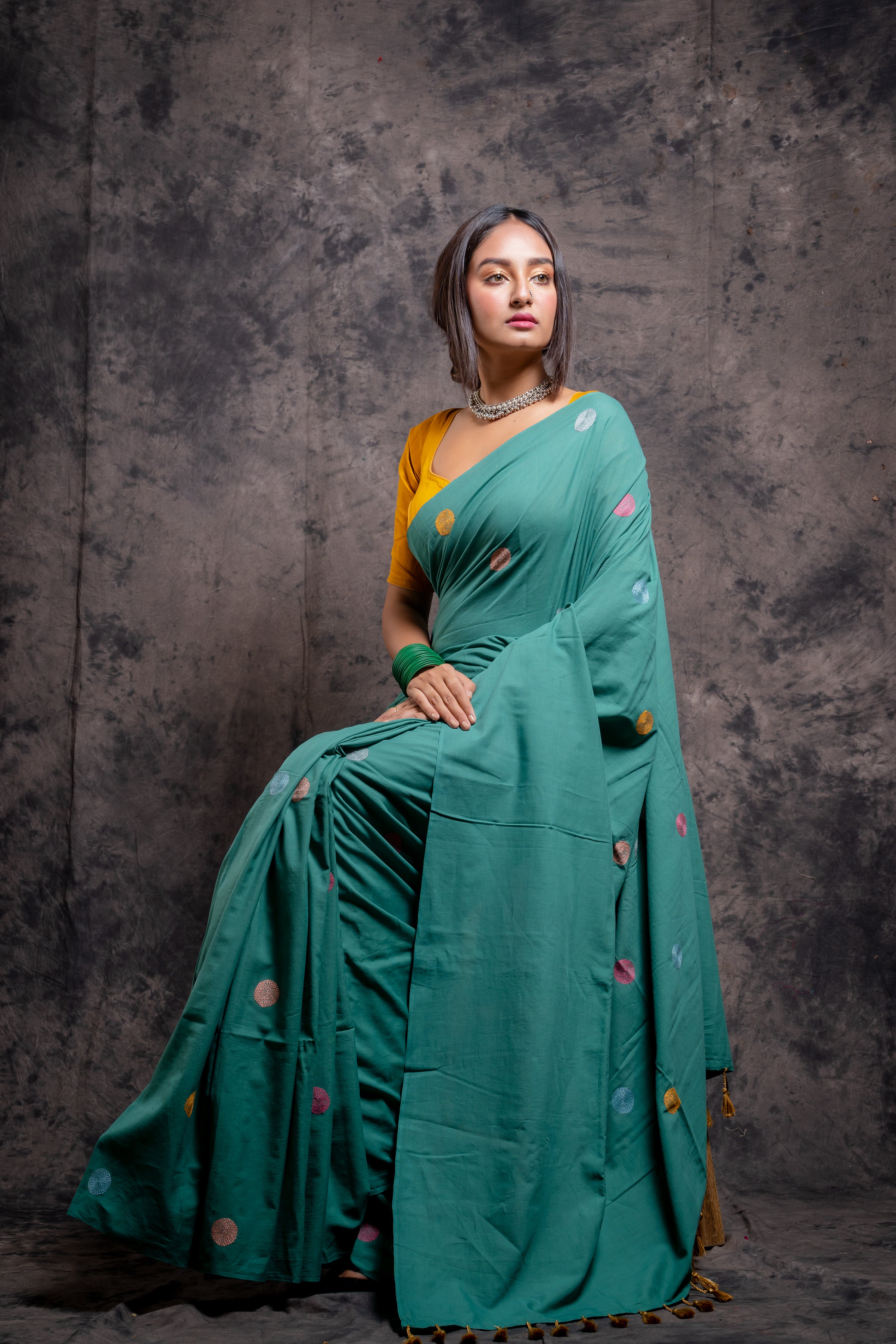 Handwoven green saree with multicolor kantha stitch