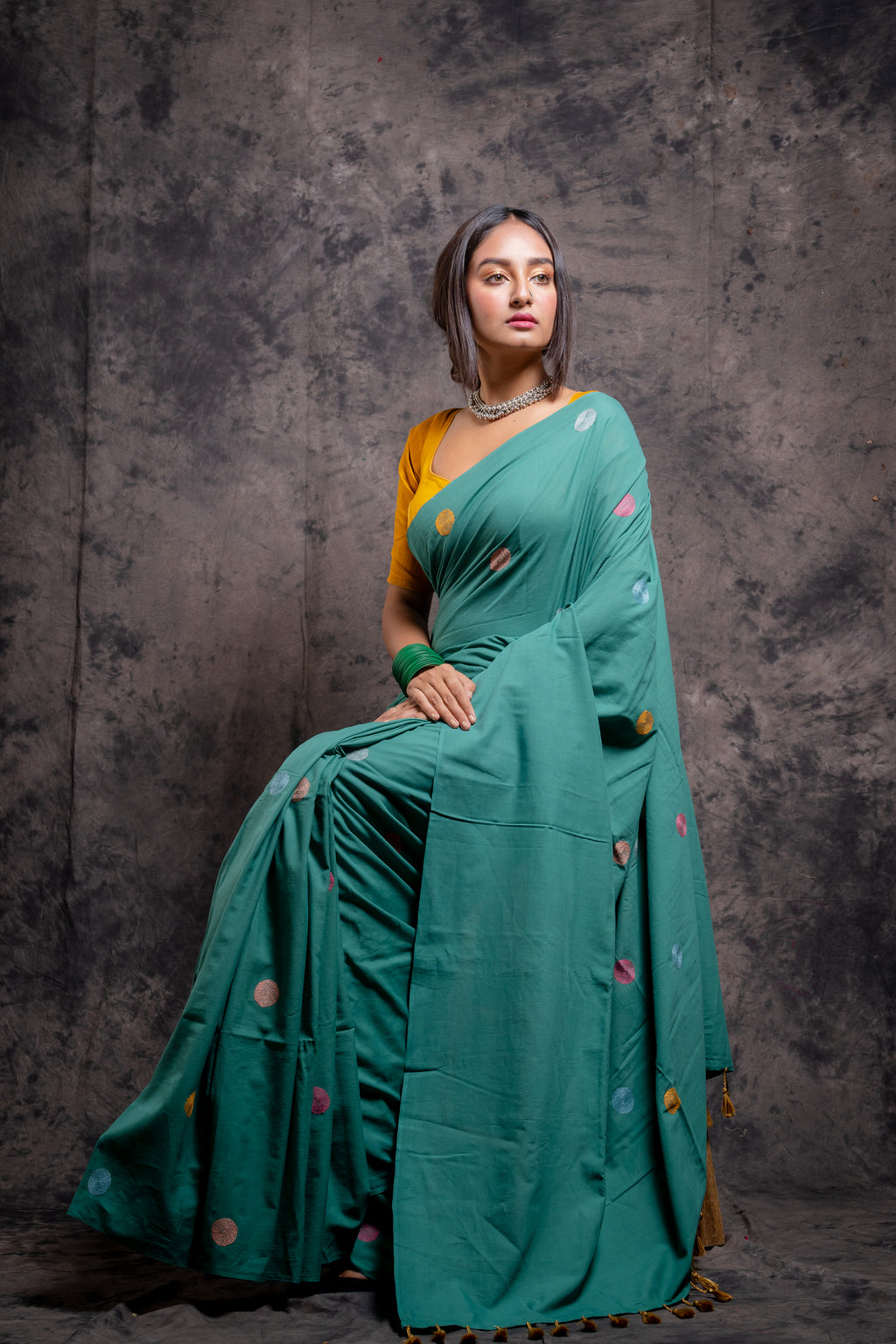 Handwoven green saree with multicolor Kantha stitch