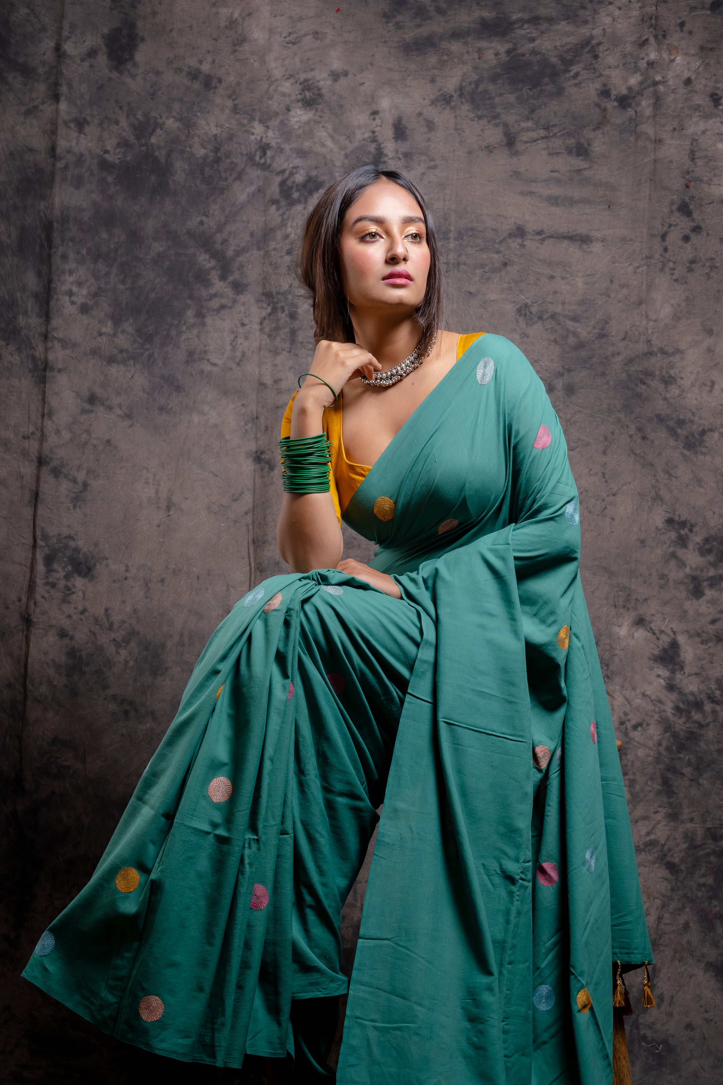 Handwoven green saree with multicolor kantha stitch