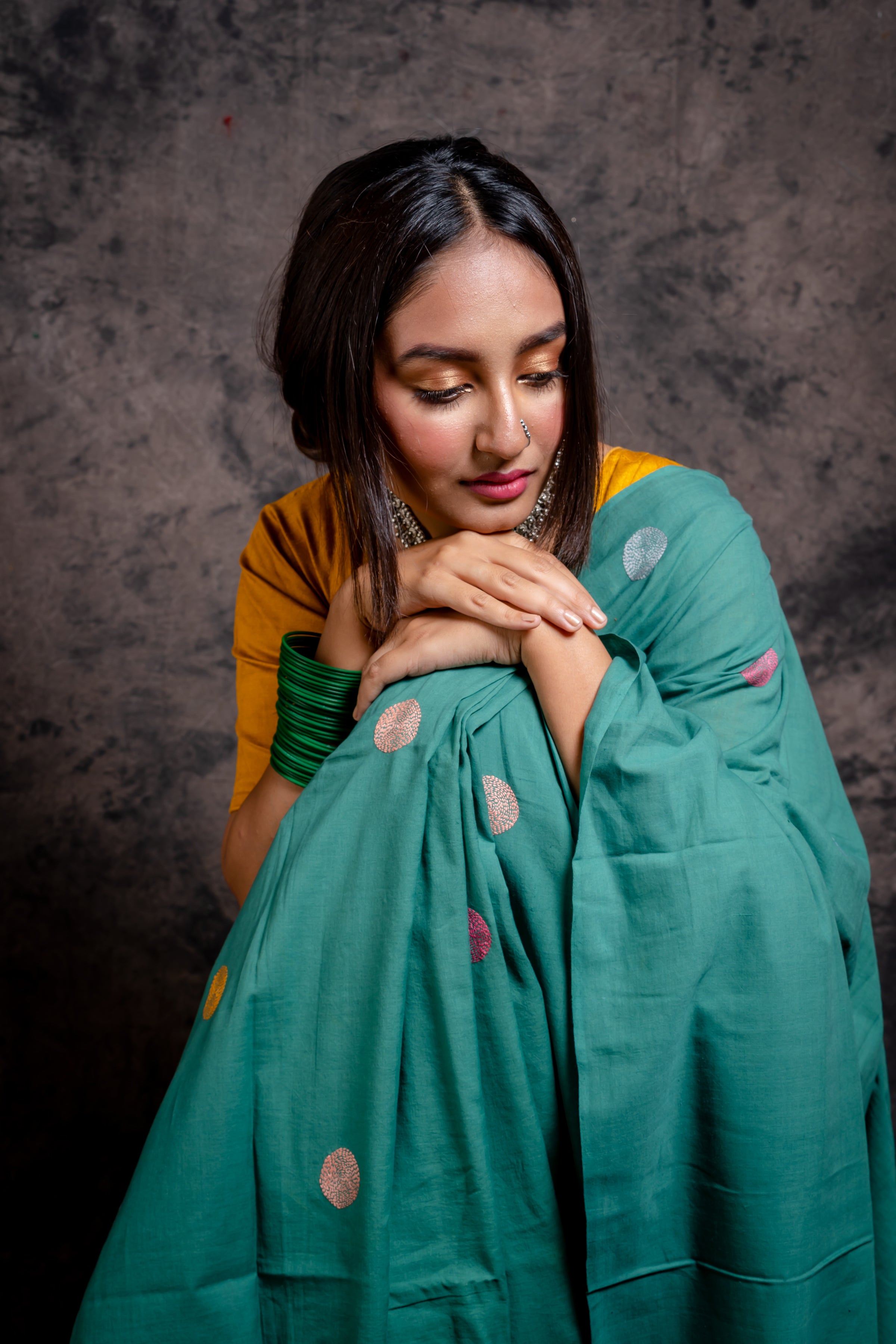 Handwoven green saree with multicolor kantha stitch