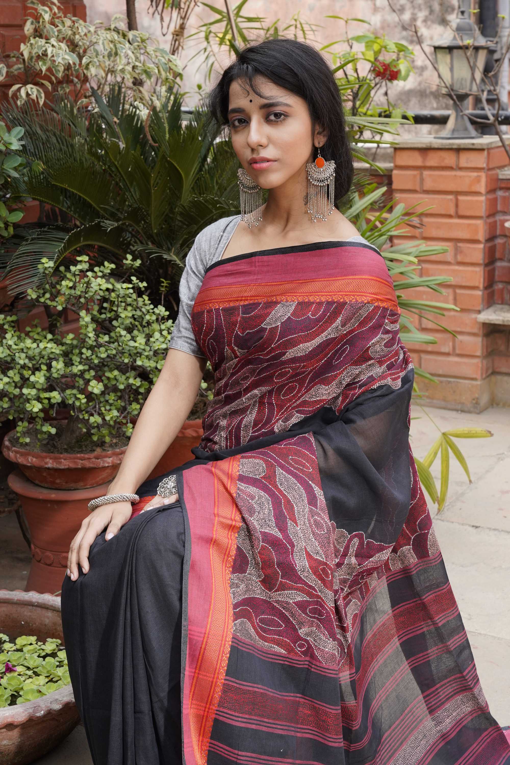 Handwoven black cotton saree with kantha work