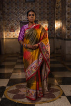 Handwoven Tussar saree with Kantha work — orange and green intricate patterns