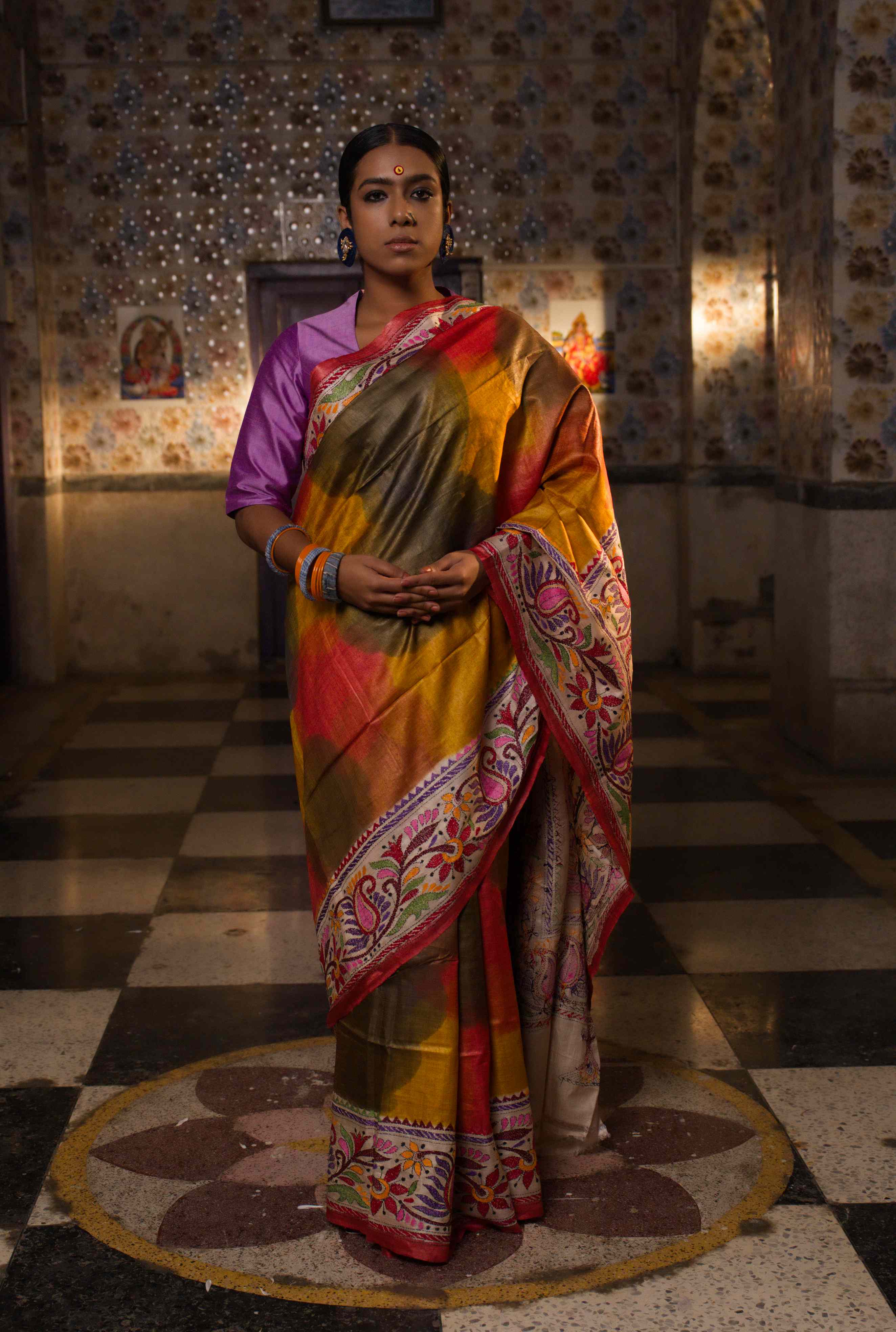 Handwoven Tussar saree with Kantha work — orange and green intricate patterns
