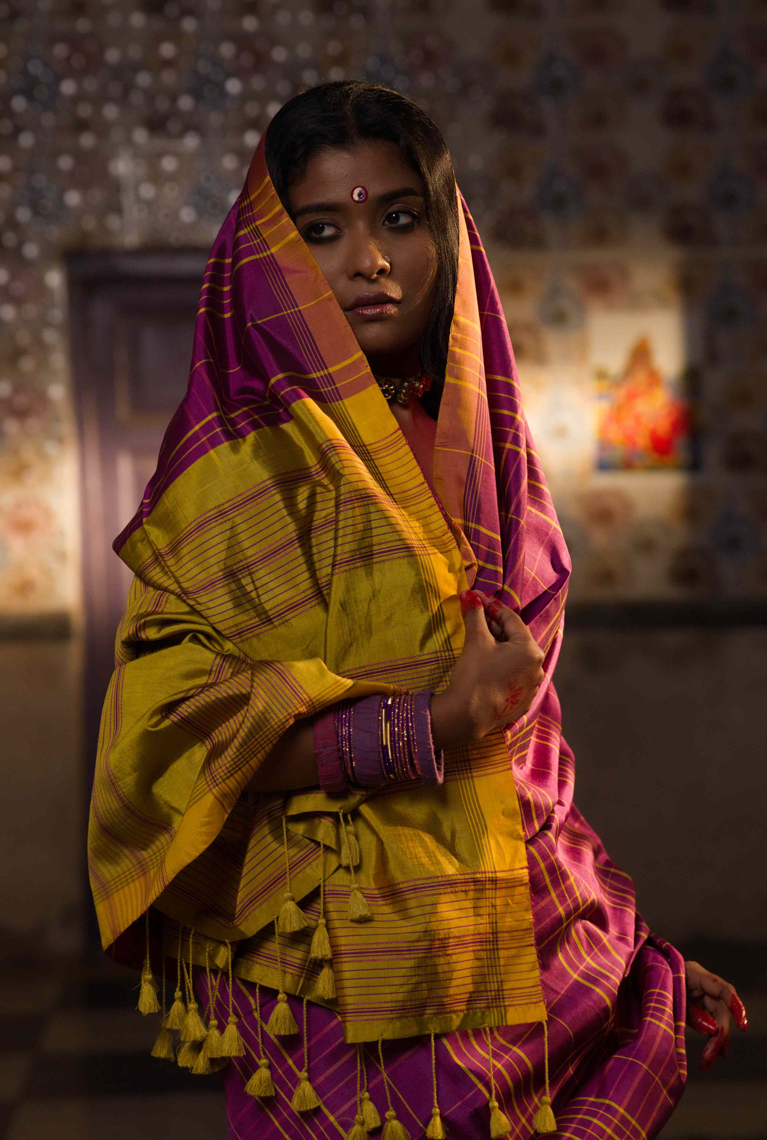 Handwoven pink yellow silk saree with intricate woven pattern