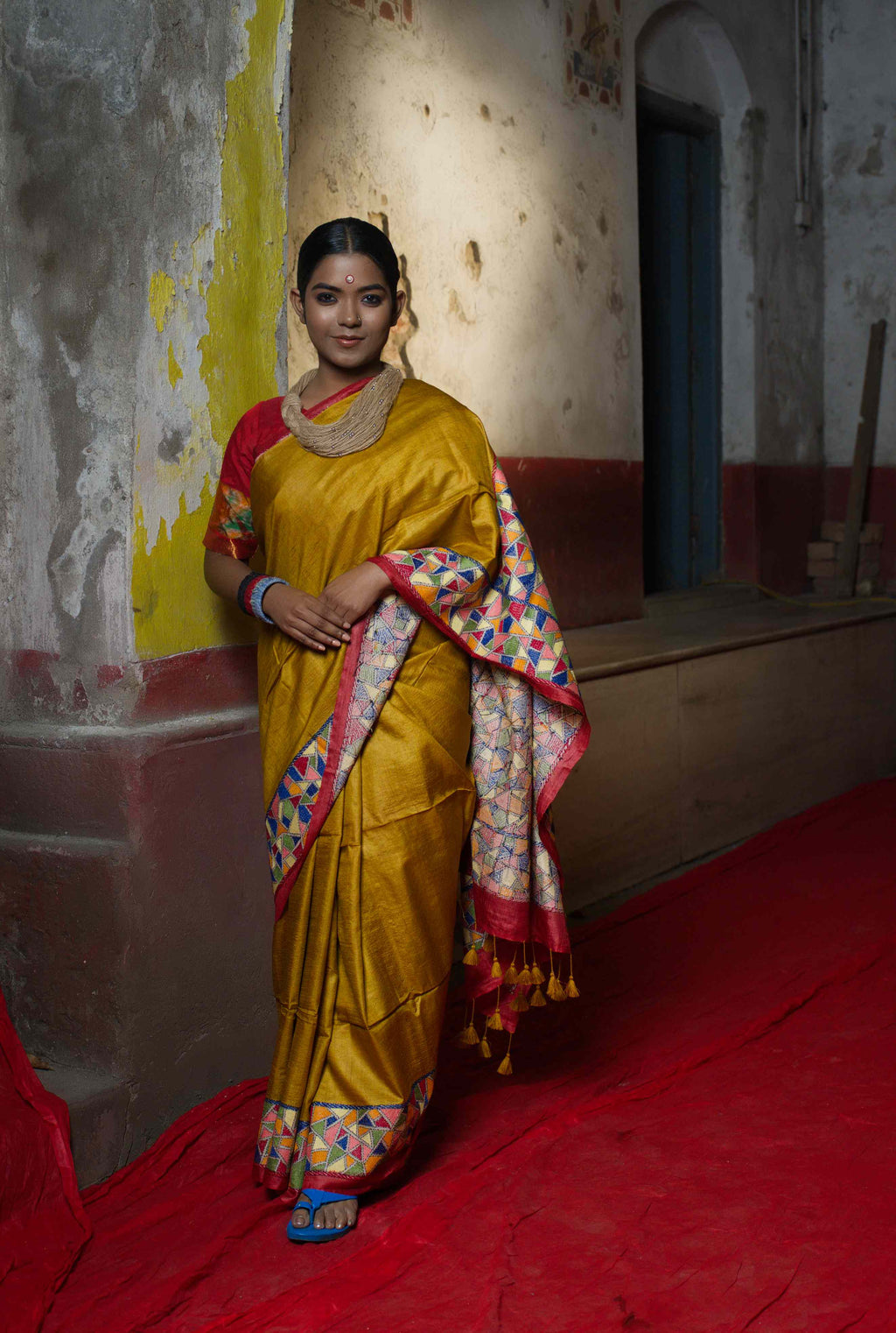 Handwoven yellow saree with multicolor Kantha work
