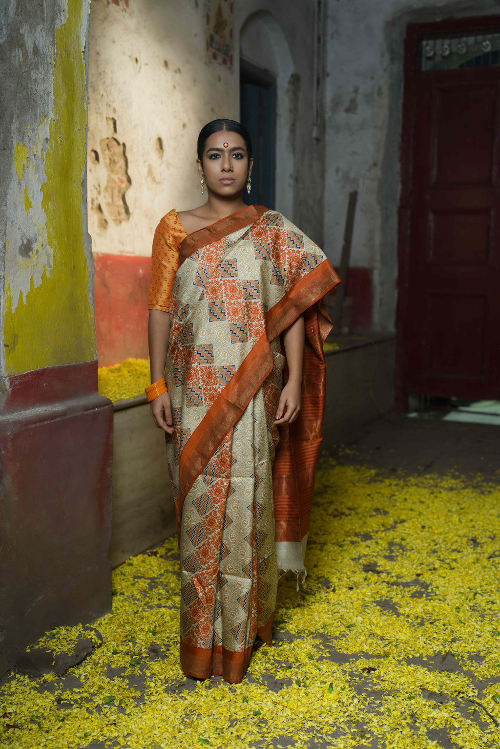 Handwoven pale copper orange silk saree with printed geometric pattern